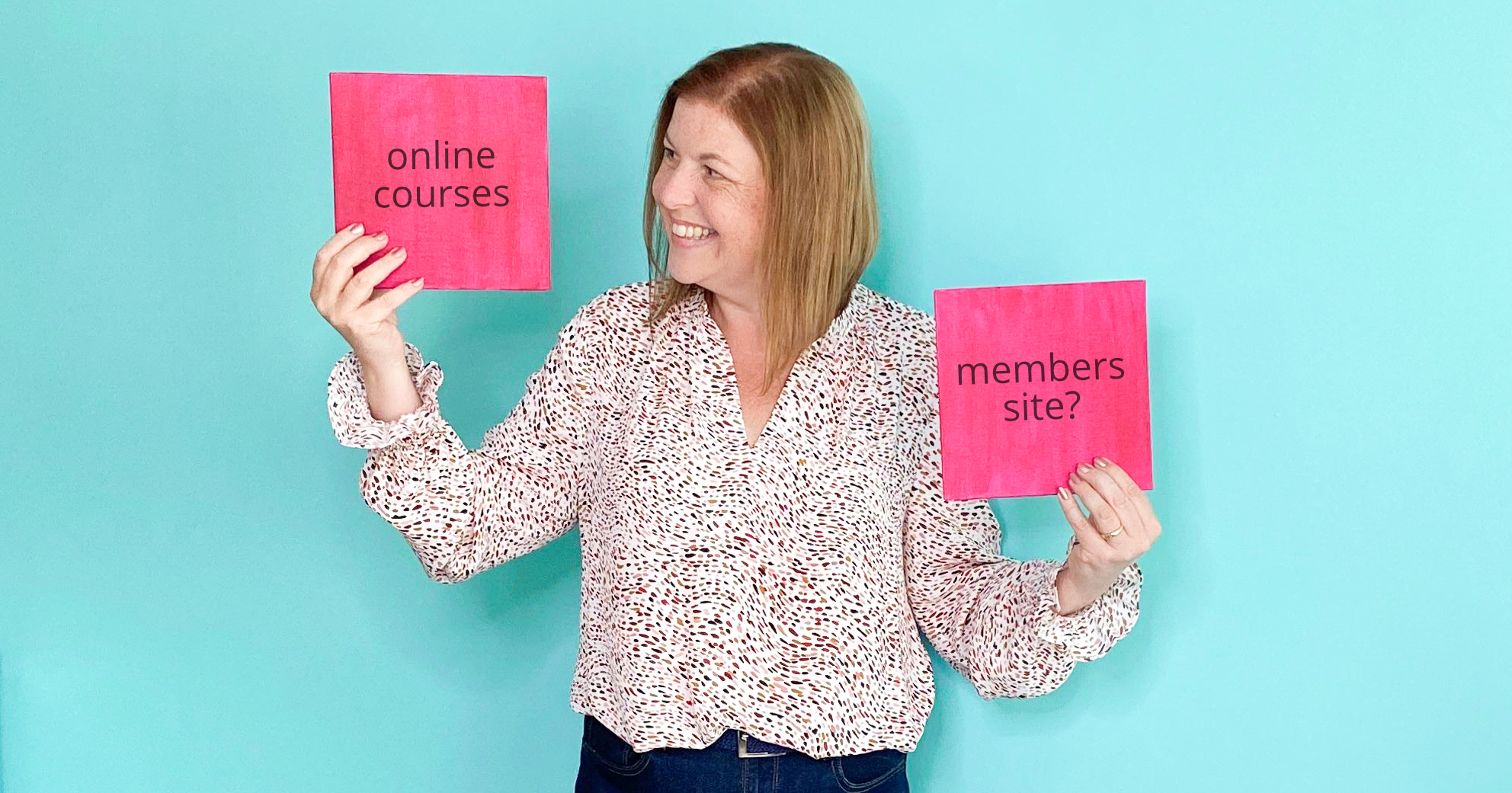Choose to Create Online Courses or a membership? Words on pink boards held up by Susanna Reay, Digital Course Expert