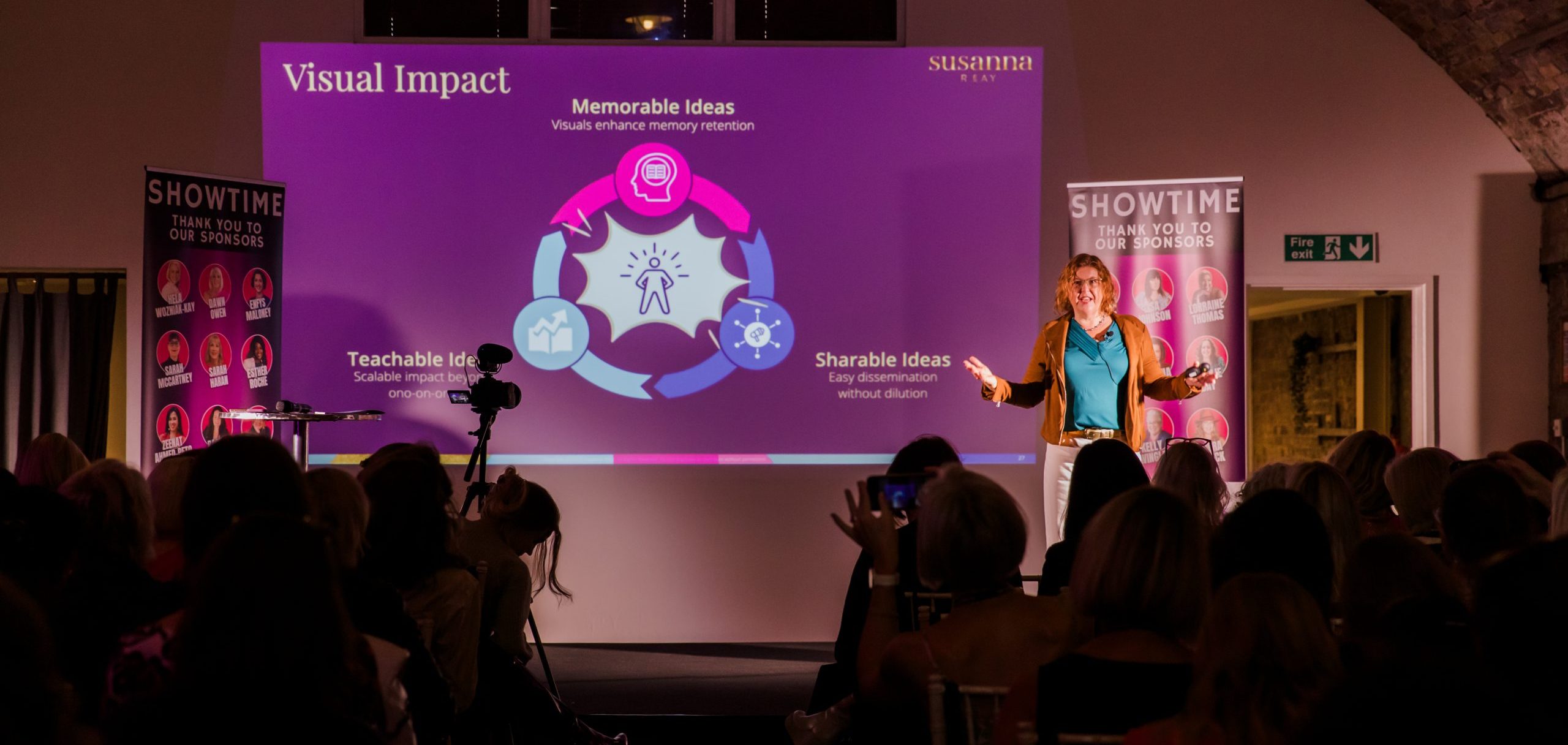 Susanna Reay, Framework thinking Business Coach, Author and Speaker, speaking on stage at Showtime 2025 in front of an audience of 120.