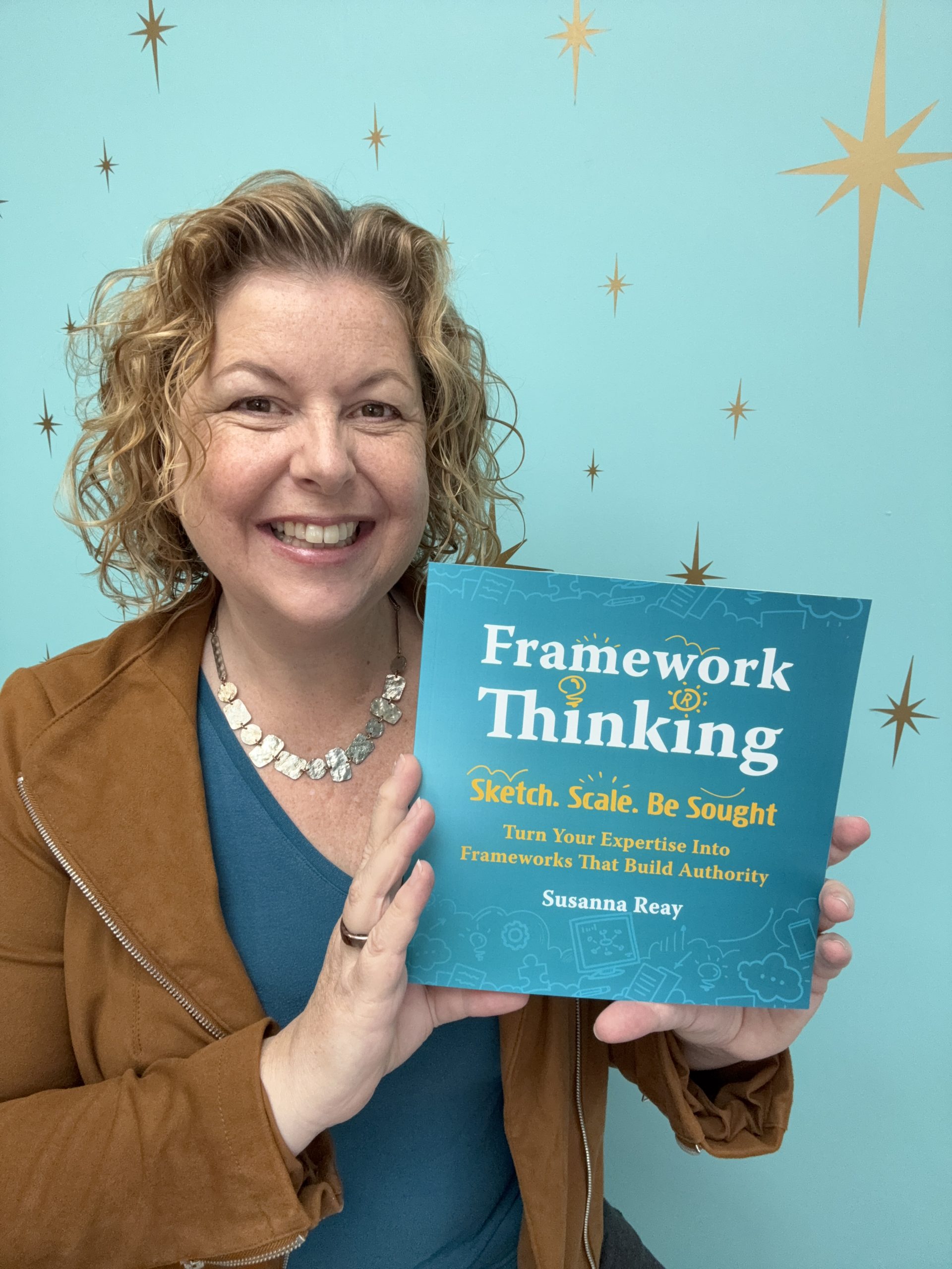 Susanna Reay with her best-selling book Framework Thinking: Sketch. Scale. Be Sought